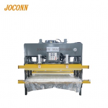 Mattress vacuum compressing machine